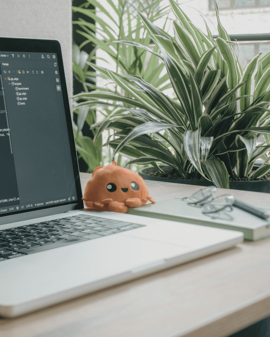 Laptop in office with plant representing a copywriter for entrepreneur's office
